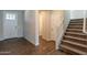 Inviting entryway featuring wood-look tile flooring and a staircase with carpeted steps at 98 N Bay Dr, Gilbert, AZ 85233
