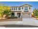 Two-story home featuring a charming front yard and an attached two-car garage at 98 N Bay Dr, Gilbert, AZ 85233