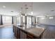 Open kitchen features granite counters, stainless appliances, and island seating at 98 N Bay Dr, Gilbert, AZ 85233