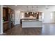 Open concept kitchen with a large island, stainless appliances, and wood flooring at 98 N Bay Dr, Gilbert, AZ 85233
