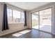 Living room area with window and glass sliding door to the backyard at 98 N Bay Dr, Gilbert, AZ 85233