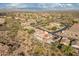 Stunning aerial view of desert home with private pool and beautiful backyard landscaping at 9816 E Stone Circle E Ln, Gold Canyon, AZ 85118