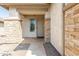 Inviting front entrance with stone accents and a covered porch area at 9816 E Stone Circle E Ln, Gold Canyon, AZ 85118