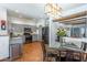 Bright kitchen with granite countertops and stainless steel appliances connected to dining area at 9816 E Stone Circle E Ln, Gold Canyon, AZ 85118