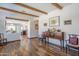 Open-concept living room with exposed beam ceilings and seamless flow to the kitchen at 9816 E Stone Circle E Ln, Gold Canyon, AZ 85118