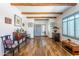 Spacious living room with beam ceilings and a clear view of the front entrance at 9816 E Stone Circle E Ln, Gold Canyon, AZ 85118
