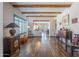 Bright living room featuring exposed beam ceilings and hardwood floors at 9816 E Stone Circle E Ln, Gold Canyon, AZ 85118