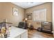 Bright office with wood floors, a large desk, and natural light from the window at 9816 E Stone Circle E Ln, Gold Canyon, AZ 85118