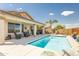 Backyard swimming pool featuring a spacious covered patio, perfect for entertaining and enjoying the outdoors at 9816 E Stone Circle E Ln, Gold Canyon, AZ 85118