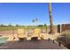 Beautiful backyard featuring lounge seating with stunning golf course views, perfect for enjoying the outdoors at 992 S Roanoke St, Gilbert, AZ 85296