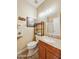 Well-lit bathroom featuring a wood vanity with granite countertop and decorative accents at 992 S Roanoke St, Gilbert, AZ 85296