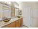 Bathroom featuring granite countertop, vessel sinks, designer tile backsplash, and upgraded lighting fixtures at 992 S Roanoke St, Gilbert, AZ 85296