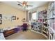Bedroom with a desk area, bookshelves, and natural light from the window at 992 S Roanoke St, Gilbert, AZ 85296