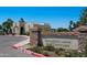Exterior view of Greenfield Lakes Golf Clubhouse, signage, and lush landscaping at 992 S Roanoke St, Gilbert, AZ 85296
