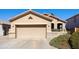 Attractive single-Gathering home with a two-car garage, stone accents, and well-manicured landscaping at 992 S Roanoke St, Gilbert, AZ 85296