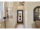 Entryway with security door, wood-look tile and sidelight window providing lots of natural light into the home at 992 S Roanoke St, Gilbert, AZ 85296