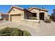 Charming single-story home featuring desert landscaping, brick accents, and a two-car garage at 992 S Roanoke St, Gilbert, AZ 85296