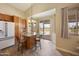 Kitchen breakfast nook with wood cabinets, granite counters and view of backyard pool at 992 S Roanoke St, Gilbert, AZ 85296