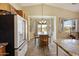 Bright kitchen features wood cabinets, granite counters, island and breakfast nook at 992 S Roanoke St, Gilbert, AZ 85296