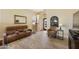 Well-lit living room with a comfortable sofa and hardwood floors at 992 S Roanoke St, Gilbert, AZ 85296