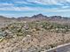 Expansive aerial shot showcases the neighborhood's mountain views, community layout and proximity to the highway at 10007 N 30Th Pl, Phoenix, AZ 85028
