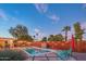 This backyard pool with desert landscaping is perfect for relaxation and outdoor fun at 10007 N 30Th Pl, Phoenix, AZ 85028