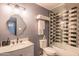 Well-appointed bathroom with marble vanity, glass-enclosed shower, and modern fixtures at 10007 N 30Th Pl, Phoenix, AZ 85028