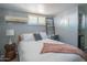 Comfortable bedroom with a desk, shutters, and minimalist decor at 10007 N 30Th Pl, Phoenix, AZ 85028