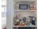 Convenient coffee bar with a microwave and beverage station next to the bedroom at 10007 N 30Th Pl, Phoenix, AZ 85028