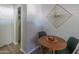 Cozy dining area with wood table and modern art, conveniently located off the hall at 10007 N 30Th Pl, Phoenix, AZ 85028