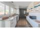 Modern kitchen with sleek white cabinetry, stainless steel appliances, and bright natural light at 10007 N 30Th Pl, Phoenix, AZ 85028