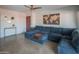 Stylish living area boasts a comfortable blue sectional, modern artwork, and contemporary furnishings at 10007 N 30Th Pl, Phoenix, AZ 85028