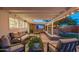 Inviting covered patio with comfortable seating, string lights, and garden views at 10007 N 30Th Pl, Phoenix, AZ 85028