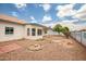 Backyard featuring a patio, desert landscaping, and a block wall for added privacy at 10215 W Missouri Ave, Glendale, AZ 85307