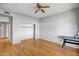 Bedroom with hardwood floors, a closet, and a view of the home's closet at 10215 W Missouri Ave, Glendale, AZ 85307