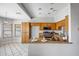 Open kitchen features modern appliances, natural wood cabinets and a breakfast bar at 10215 W Missouri Ave, Glendale, AZ 85307