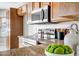 Kitchen features granite countertops, stainless steel appliances, and wood cabinetry at 10215 W Missouri Ave, Glendale, AZ 85307