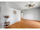 Open living room boasting hardwood floors, decorative accents, and a ceiling fan at 10215 W Missouri Ave, Glendale, AZ 85307