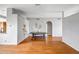Bright open-concept living area featuring beautiful hardwood floors and neutral wall colors at 10215 W Missouri Ave, Glendale, AZ 85307