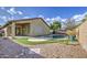 Charming backyard view with a pool, patio area and low maintenance landscaping at 10465 E Dutchmans Trl, Gold Canyon, AZ 85118