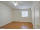 Bedroom with light walls, wood-look flooring, and a single window with blinds at 10465 E Dutchmans Trl, Gold Canyon, AZ 85118