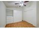 Bright bedroom featuring built-in shelves and drawers for organized storage and laminate flooring at 10465 E Dutchmans Trl, Gold Canyon, AZ 85118