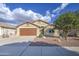 Inviting single-Gathering home featuring a two-car garage and low-maintenance desert landscaping at 10465 E Dutchmans Trl, Gold Canyon, AZ 85118