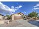Attractive single-level home with a spacious driveway and easy-care desert front yard at 10465 E Dutchmans Trl, Gold Canyon, AZ 85118