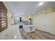 Bright kitchen features white cabinets, marble countertops, stainless steel appliances and central island at 10465 E Dutchmans Trl, Gold Canyon, AZ 85118