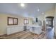 Bright kitchen features white cabinets, marble countertops, stainless steel appliances and central island at 10465 E Dutchmans Trl, Gold Canyon, AZ 85118