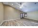 Large living room with vaulted ceilings, ceiling fan, and wood-look vinyl plank flooring at 10465 E Dutchmans Trl, Gold Canyon, AZ 85118