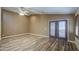 Large living room with vaulted ceilings, ceiling fan, and wood-look vinyl plank flooring at 10465 E Dutchmans Trl, Gold Canyon, AZ 85118