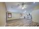 Open concept living room features a bright kitchen and luxury vinyl plank floors at 10465 E Dutchmans Trl, Gold Canyon, AZ 85118