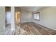 Inviting living room with hardwood floors and natural light entering through the windows at 10465 E Dutchmans Trl, Gold Canyon, AZ 85118